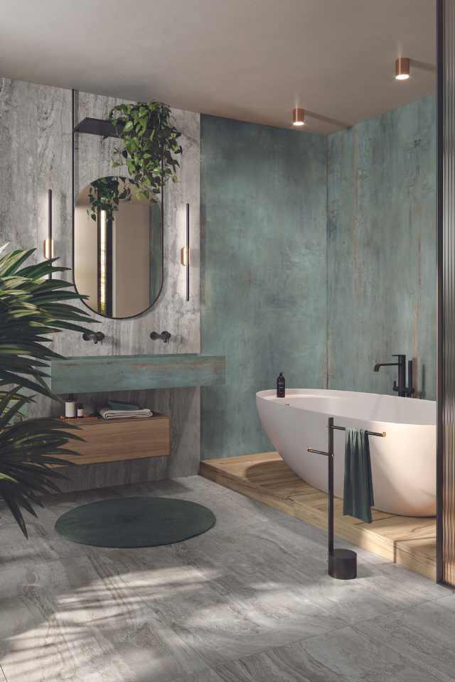 porcelain tile in biophilic designed bathroom with living greenery, natural stone wall, and stone sink